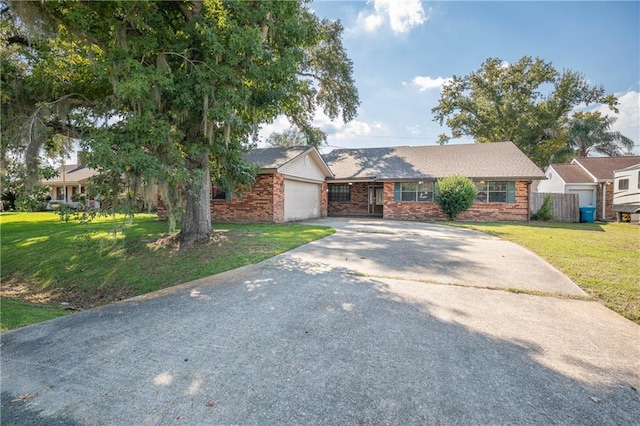 ranch-style home with a front yard and a garage