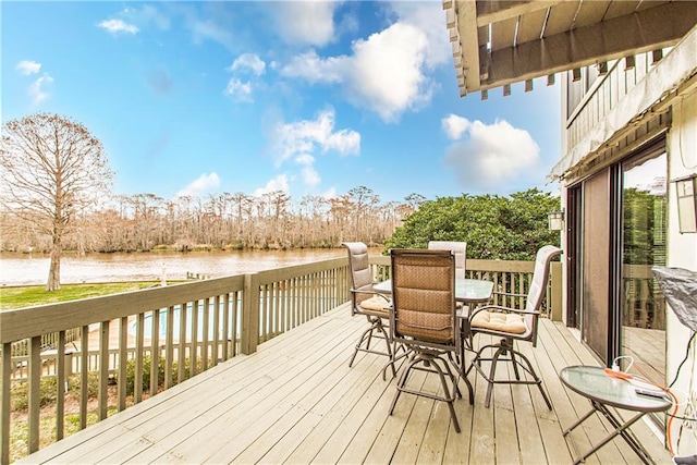 wooden deck featuring a water view