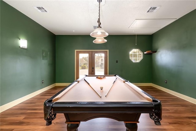 recreation room with french doors, hardwood / wood-style flooring, and billiards