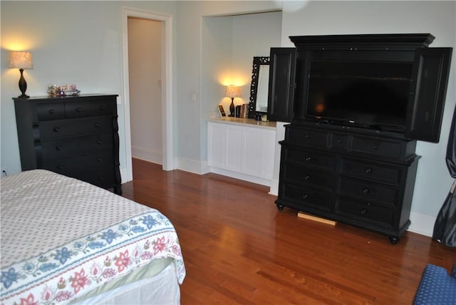 bedroom featuring dark wood-type flooring