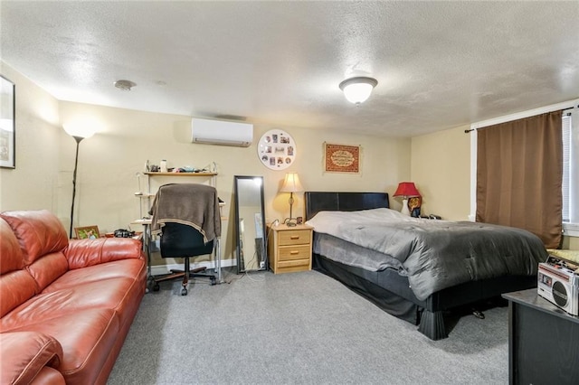 bedroom featuring an AC wall unit, light carpet, and a textured ceiling