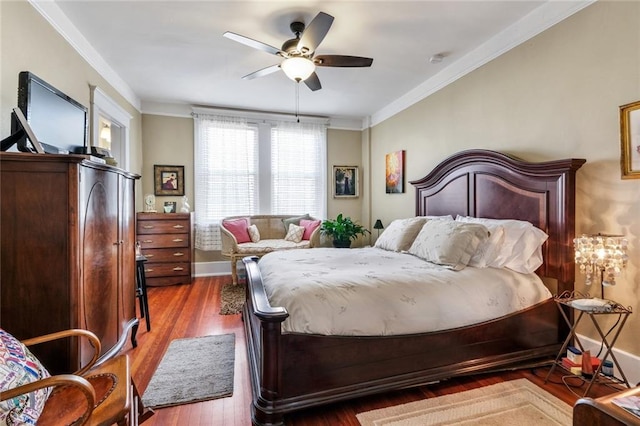 bedroom with dark hardwood / wood-style floors, ceiling fan, and ornamental molding