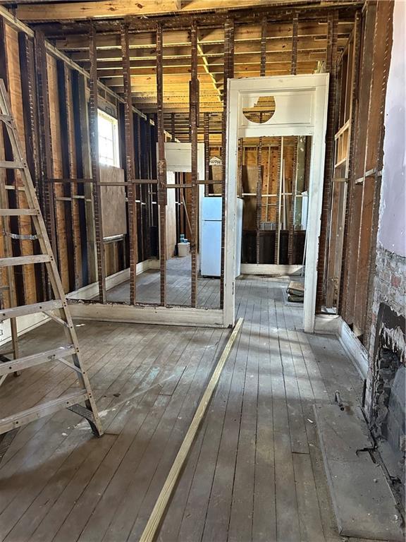 misc room with dark wood-type flooring