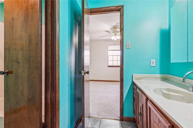 bathroom featuring tile floors, large vanity, and ceiling fan