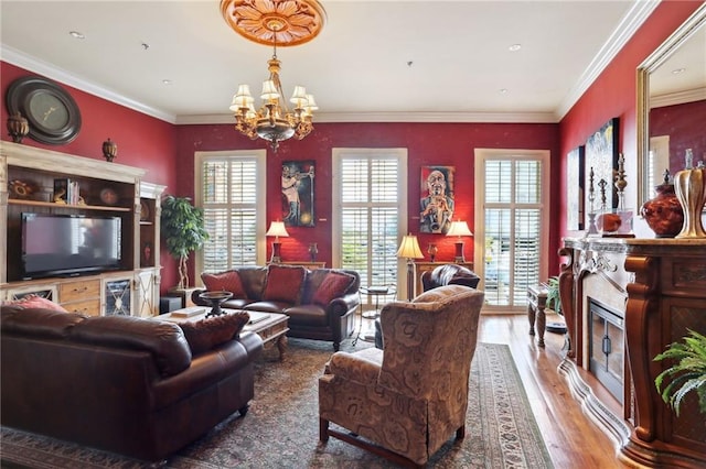 living room with an inviting chandelier, crown molding, and dark wood-type flooring