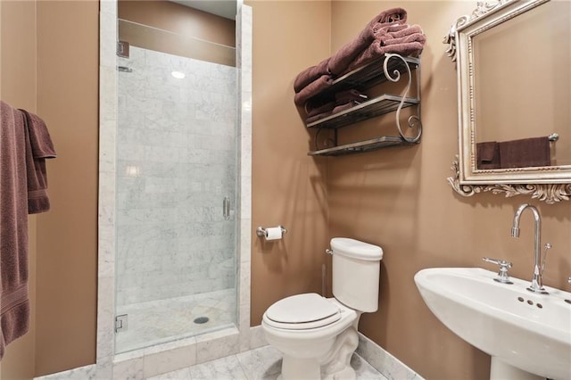 bathroom featuring sink, tile floors, toilet, and a shower with shower door