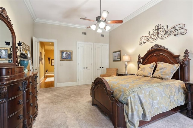 carpeted bedroom featuring crown molding and ceiling fan