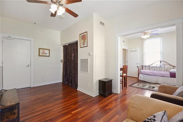 bedroom featuring ceiling fan and dark wood-type flooring