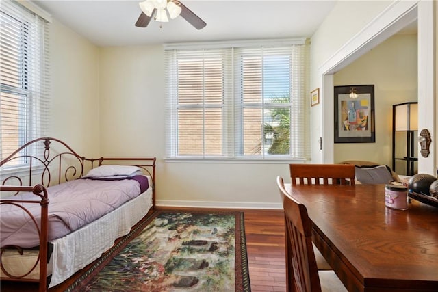 bedroom featuring ceiling fan and dark wood-type flooring