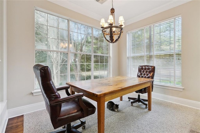 office featuring an inviting chandelier, crown molding, plenty of natural light, and wood-type flooring