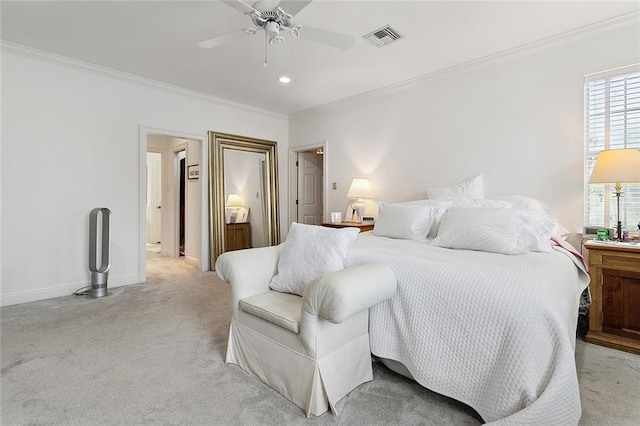 bedroom with crown molding, ceiling fan, and light colored carpet