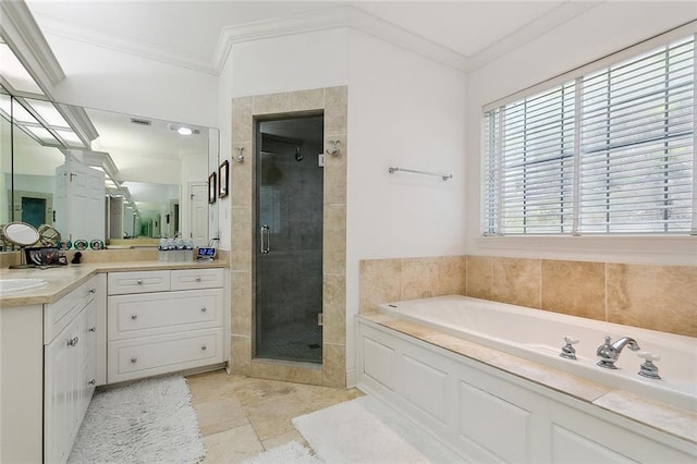 bathroom with tile floors, large vanity, crown molding, and separate shower and tub