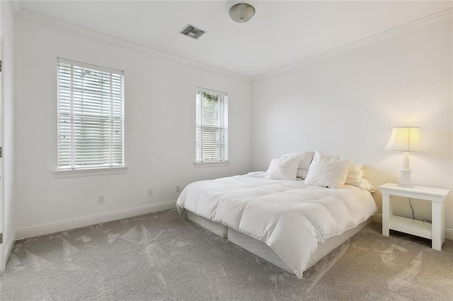 bedroom with light carpet and crown molding