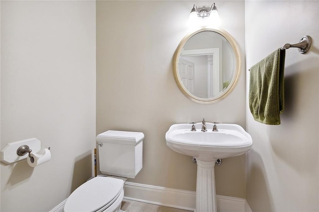 bathroom with tile floors and toilet