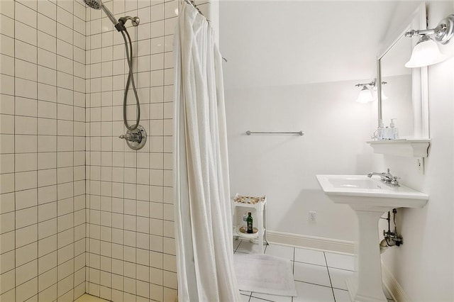 bathroom with tile flooring and a shower with curtain