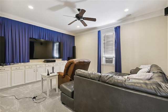 carpeted living room with ceiling fan and crown molding