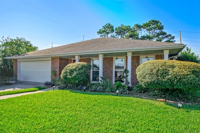 ranch-style house featuring a front yard and a garage