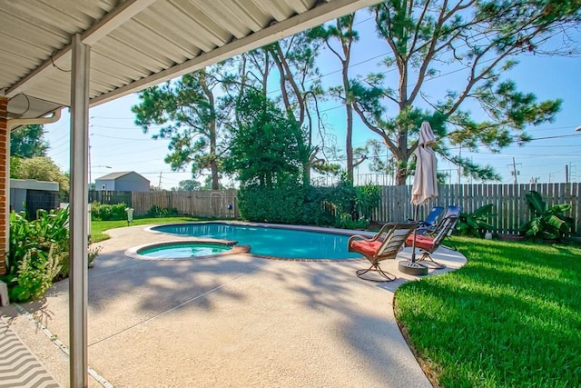 view of pool featuring a patio, a lawn, a fenced backyard, and a pool with connected hot tub