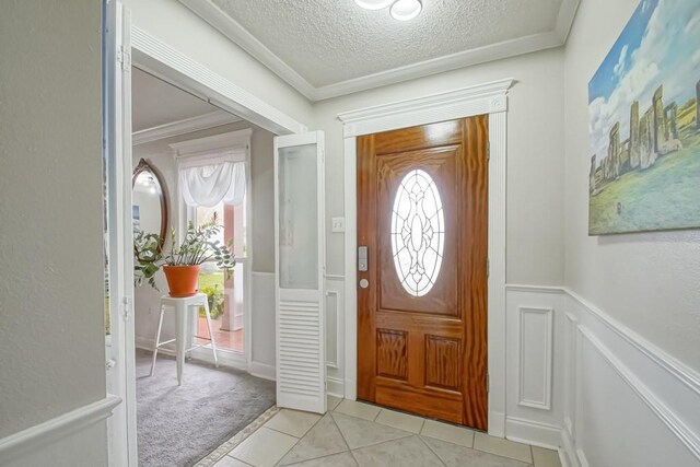 tiled living room featuring ornamental molding, a textured ceiling, and a brick fireplace