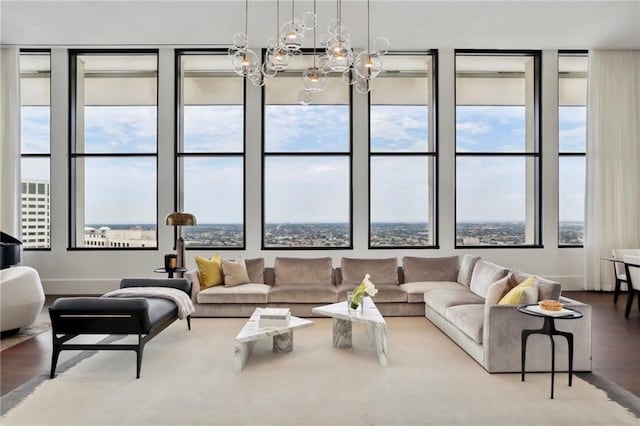 living room featuring an inviting chandelier and hardwood / wood-style floors