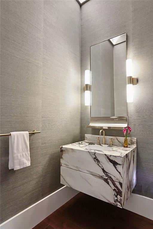 bathroom featuring vanity and hardwood / wood-style flooring