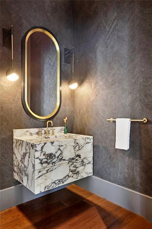 bathroom with hardwood / wood-style floors and sink