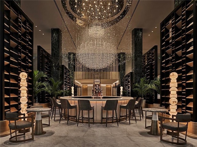 wine area with bar area and a chandelier