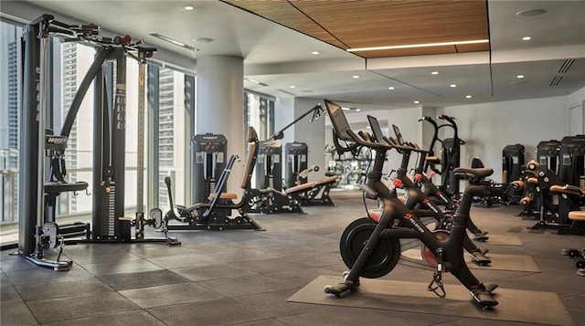 exercise room featuring floor to ceiling windows