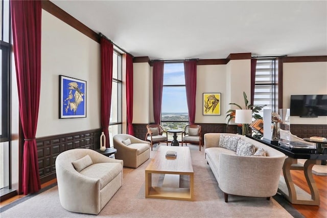 living room with floor to ceiling windows and wood-type flooring