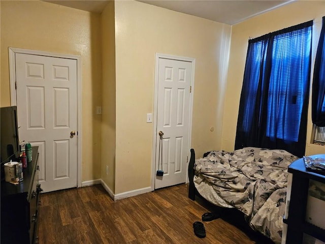 bedroom featuring dark hardwood / wood-style flooring