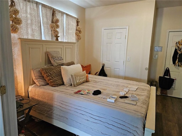 bedroom featuring dark wood-type flooring