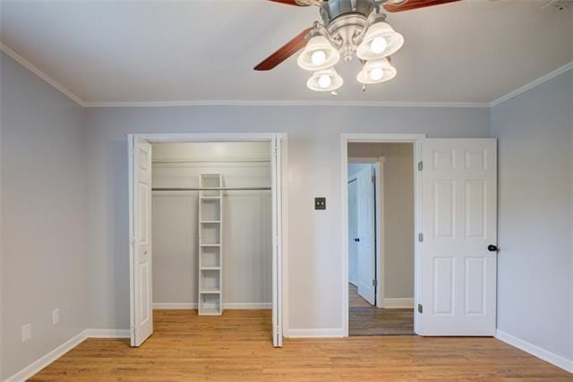 unfurnished bedroom featuring a closet, ceiling fan, ornamental molding, and light hardwood / wood-style flooring