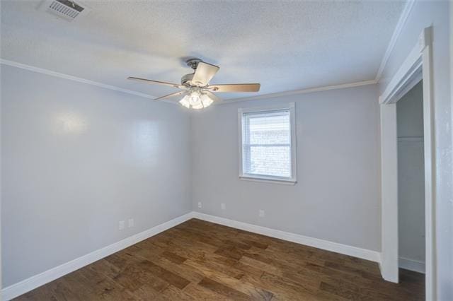 unfurnished bedroom with dark hardwood / wood-style floors, ceiling fan, and ornamental molding