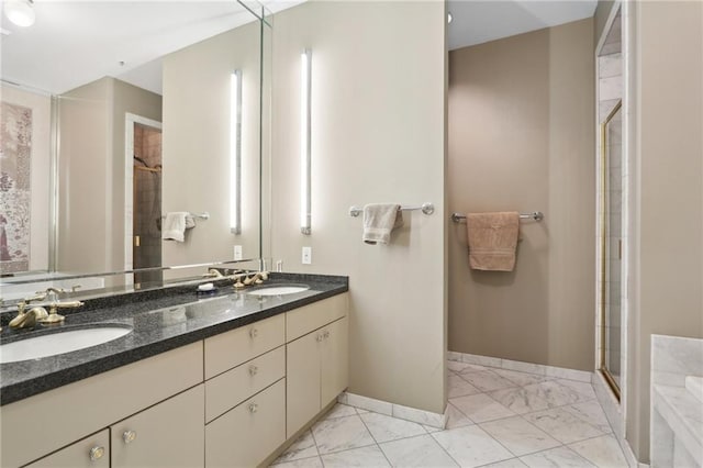 bathroom with vanity and a shower with shower door