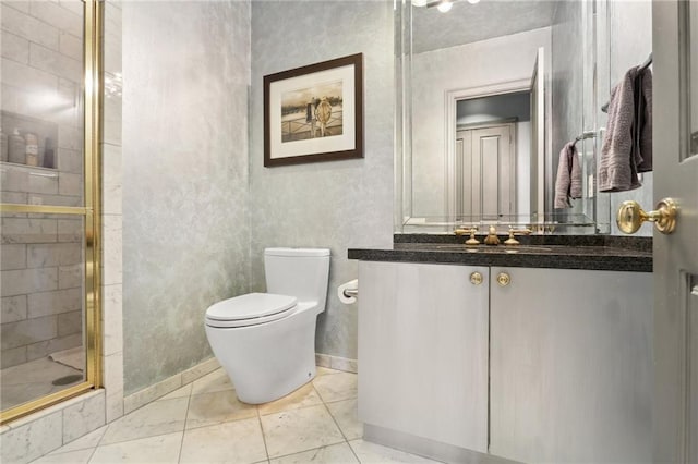 bathroom featuring an enclosed shower, vanity, and toilet