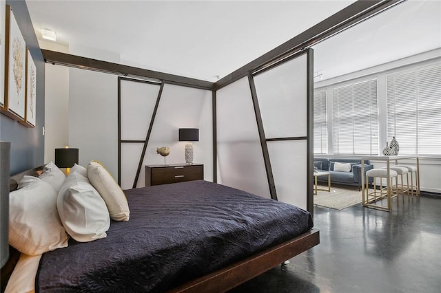 bedroom with concrete flooring