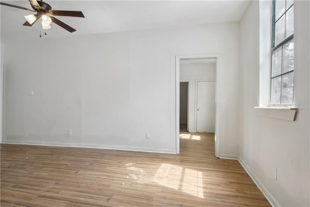 unfurnished room featuring ceiling fan and light hardwood / wood-style flooring