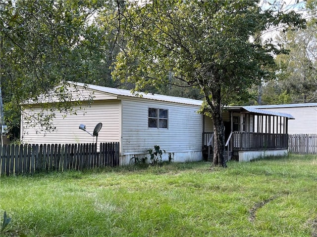 back of house with a yard