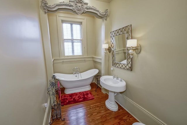 bathroom with hardwood / wood-style floors