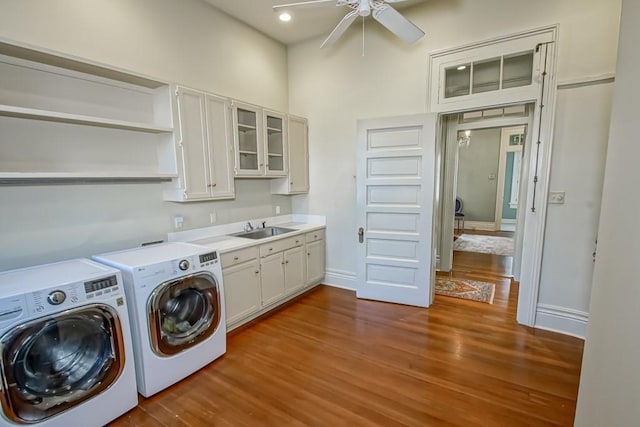 washroom featuring light hardwood / wood-style flooring, ceiling fan, cabinets, and sink