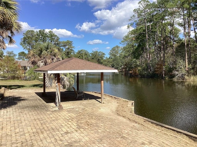 dock area with a gazebo and a water view