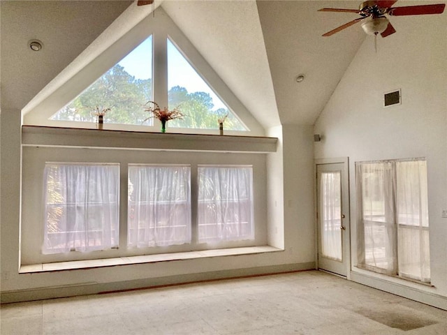 interior space with high vaulted ceiling and ceiling fan