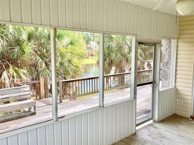 unfurnished sunroom with plenty of natural light