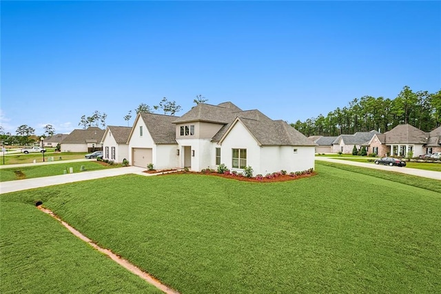 view of front facade featuring a front yard and a garage