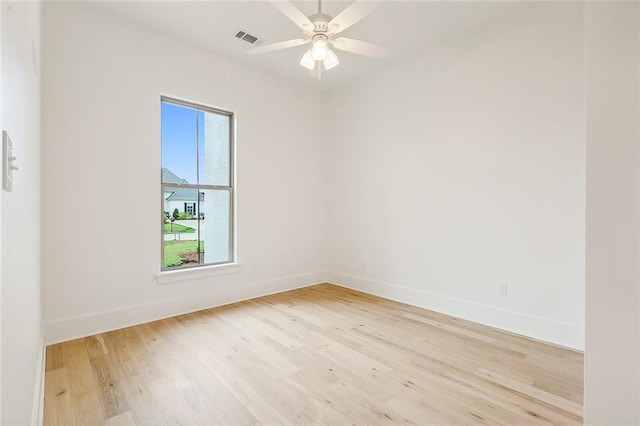 spare room featuring ceiling fan and light hardwood / wood-style flooring