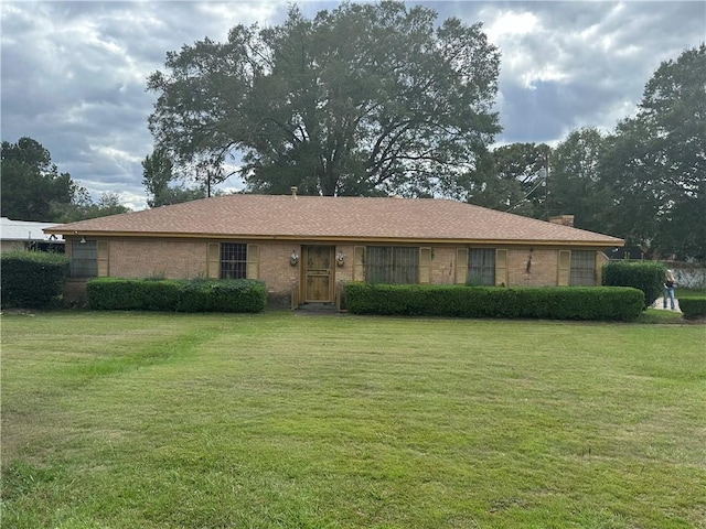 ranch-style house with a front lawn