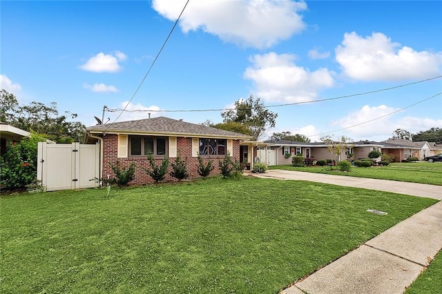 single story home with a front yard