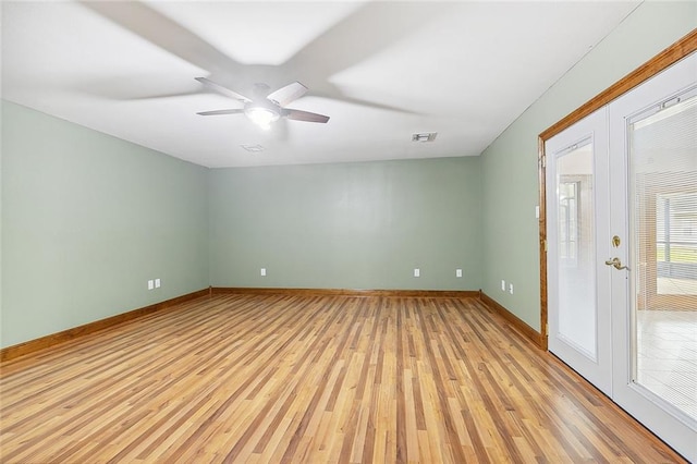 unfurnished room with ceiling fan and light wood-type flooring