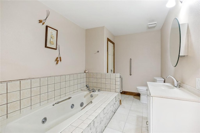 bathroom with tiled bath, toilet, tile floors, and oversized vanity