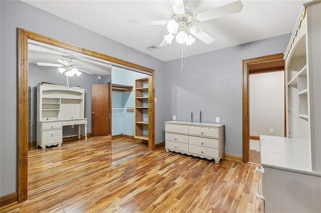 bedroom featuring a closet, ceiling fan, and light hardwood / wood-style flooring